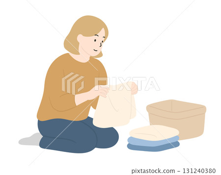 Woman folding laundry, housework 131240380