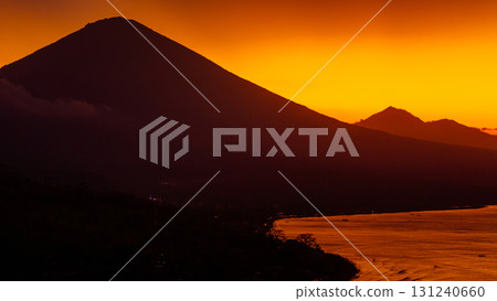 Drone view with Agung volcano and sunset with ocean in Bali. Drone view with Agung volcano and sunset with ocean in Bali. 131240660