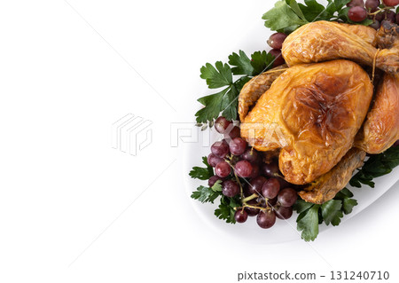 Roast turkey with grapes and parsley on white plate Roast turkey with grapes and parsley on white plate 131240710