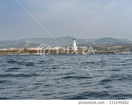 Tarifa island, lighthouse and Spanish mainland Tarifa island, lighthouse and Spanish mainland 131240882