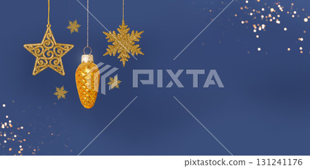 Christmas blue background with Christmas tree decorations with a golden snowflake, star and cone and golden lights with copy space. New Year and Christmas card. Christmas blue background with Christmas tree decorations with a golden snowflake, star and cone and golden lights with copy space. New Year and Christmas card. 131241176