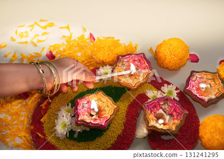 Lighting Diwali Candles with Care and Tradition Lighting Diwali Candles with Care and Tradition 131241295