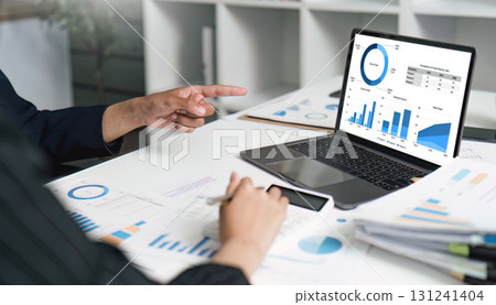 Data Analysis and Reporting. Business professional analyzing financial charts on laptop. Data Analysis and Reporting. Business professional analyzing financial charts on laptop. 131241404