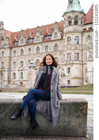Woman in casual style near historic building Woman in casual style near historic building 131241889