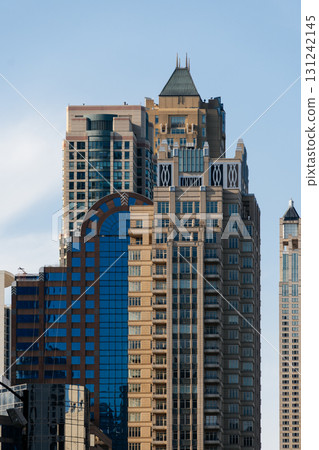 Close-up shot of various skyscrapers reaching up towards a clear blue sky in Chicago, Illinois. Close-up shot of various skyscrapers reaching up towards a clear blue sky in Chicago, Illinois. 131242145