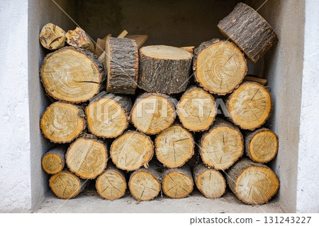 Preparing firewood for the winter. Sawed logs Preparing firewood for the winter. Sawed logs 131243227