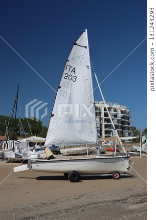 Sailboat standing on the beach on a sunny day with blue sky 131243293
