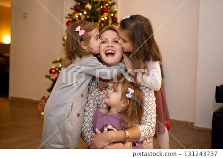 Joyful family moment with laughter and love during the holidays 131243737
