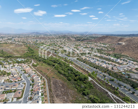 Aerial view of a sprawling neighborhood of family homes in Menifee, California, USA. Aerial view of a sprawling neighborhood of family homes in Menifee, California, USA. 131244213
