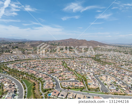 Aerial view of a sprawling neighborhood of family homes in Menifee, California, USA. Aerial view of a sprawling neighborhood of family homes in Menifee, California, USA. 131244216