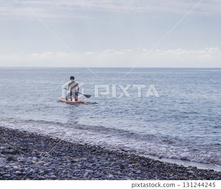 Shot of the boy on the puddle board Shot of the boy on the puddle board 131244245