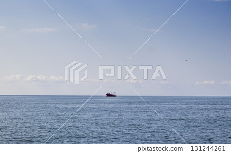Shot of the fishing trawler on the horizon 131244261