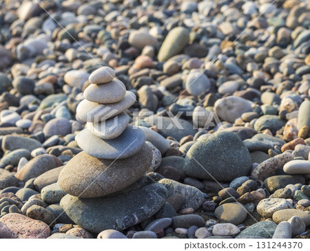 Cairn made of pebbles on the sea shore 131244370