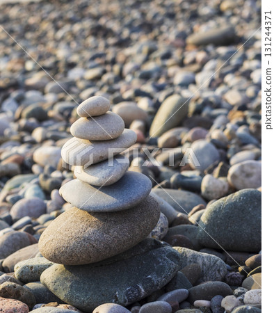 Cairn made of pebbles on the sea shore Cairn made of pebbles on the sea shore 131244371