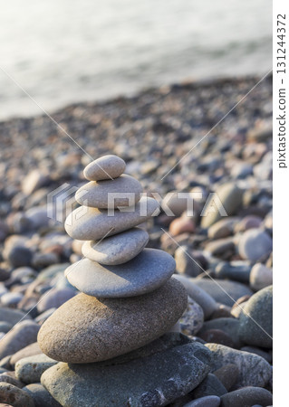 Cairn made of pebbles on the sea shore Cairn made of pebbles on the sea shore 131244372