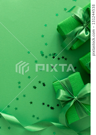 Green Gift Boxes with Confetti on Festive Background Green Gift Boxes with Confetti on Festive Background 131244538