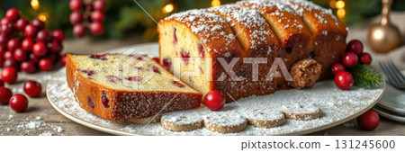 Homemade cranberry bread adorned with powdered sugar on a festive table setting during the holiday season 131245600