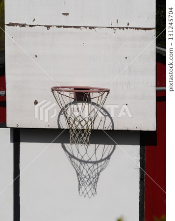 Basketball net is hanging from a wall 131245704