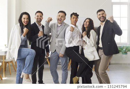 Group Portrait Of Happy Business Team Celebrating Group Portrait Of Happy Business Team Celebrating 131245794