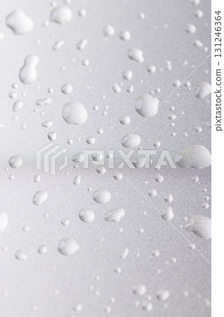 silver colored metal surface covered with drops of pure water, wet silver-colored metal painted to protect aluminum alloy and metals, close up 131246364