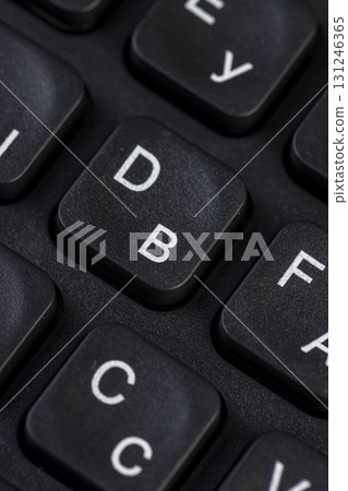 keyboard with Russian and English letters closeup, bilingual computer keyboard layout with Latin and Cyrillic alphabet 131246365