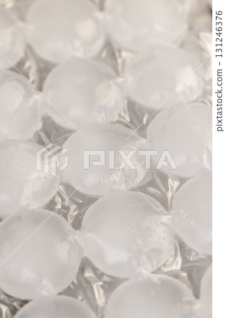 white ice in bags for freezing water, frozen water in special bags for making ice and using it in drinks and cocktails white ice in bags for freezing water, frozen water in special bags for making ice and using it in drinks and cocktails 131246376