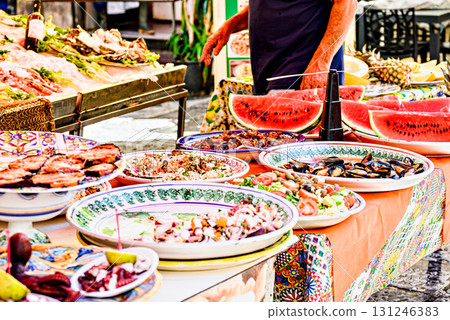Colorful fruit and food stalls at the Vucciria market (Loggia district) in Palermo. Tapas area in the old town 131246383