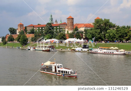 Tourist boats cruise the Vistula River in Krakow, Poland, 131246529