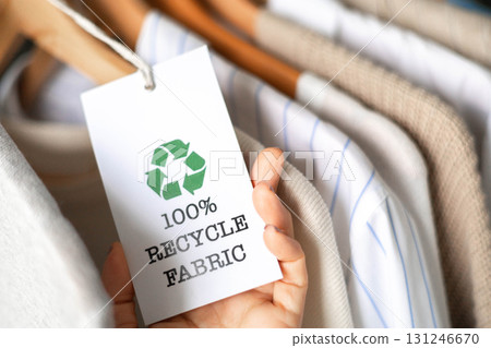 Sustainable fashion tag with 100 percent recycle fabric label in eco-friendly clothing store 131246670