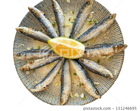 Grilled Sardines on Plate with Lemon Slice - Mediterranean Cuisine Grilled Sardines on Plate with Lemon Slice - Mediterranean Cuisine 131246695