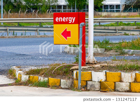 Arrow showing direction to petrol station on street 131247117
