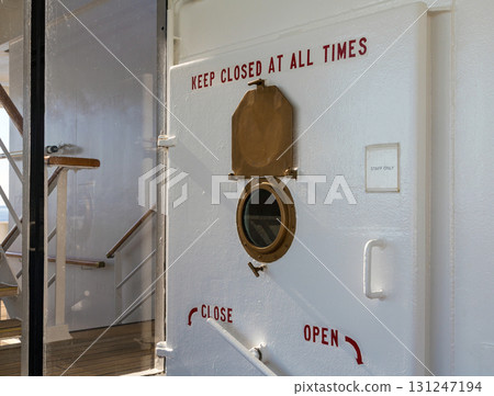 Safety bulkhead closed door on ship Safety bulkhead closed door on ship 131247194