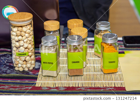 Spices in glass jars on market 131247214