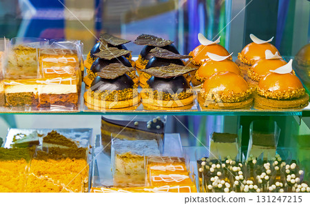 Sweet chocolate cakes on shelf Sweet chocolate cakes on shelf 131247215