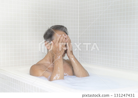 A man in his 60s taking a bath A man in his 60s taking a bath 131247431