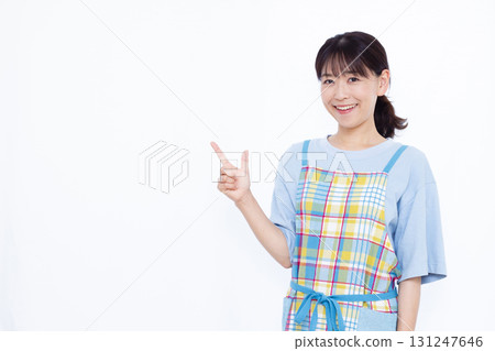 Housewife with index finger up Housewife with index finger up 131247646