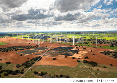 Aerial drone shot of solar panels and wind 131247876