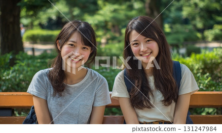 Two close friends sitting on a bench 5 Two close friends sitting on a bench 5 131247984