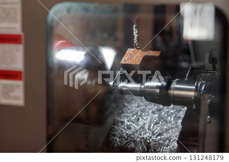CNC lathe machine working with parting tool 131248179