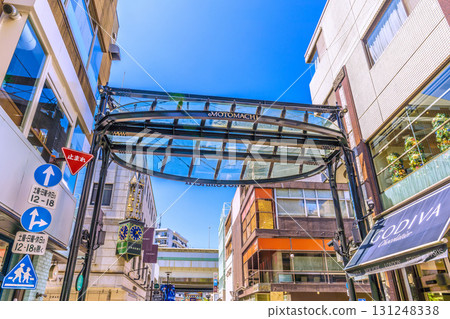 Yokohama cityscape in Japan. View of Yokohama's Motomachi district. In the background is the Suzaku Gate of Yokohama Chinatown. 131248338