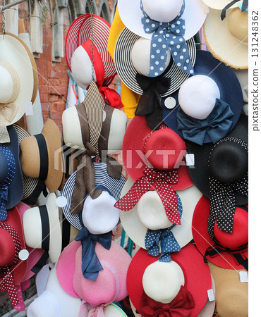 Colorful summer straw hats sold on market Colorful summer straw hats sold on market 131248362