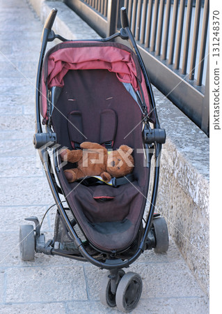 Teddy Bear toy inside empty stroller Teddy Bear toy inside empty stroller 131248370