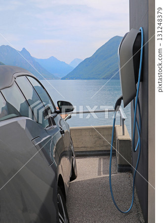 Electric car next to charging station Electric car next to charging station 131248379