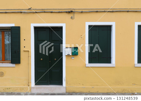 Yellow facade house entrance Yellow facade house entrance 131248539