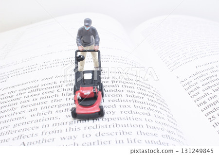 Miniature Forklift On Open Book: Symbolizing Learning, 131249845