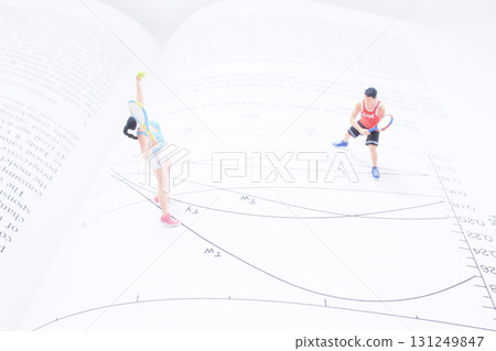 Miniature Tennis Players On Open Book With Diagram 131249847