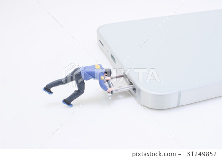 Tiny Figure Pushing Card Into Smartphone Sim Tray For Data Transfer Concept Tiny Figure Pushing Card Into Smartphone Sim Tray For Data Transfer Concept 131249852