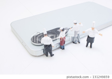 Miniature Chef Team Assembles On a Smartphone To Showcase Miniature Chef Team Assembles On a Smartphone To Showcase 131249859
