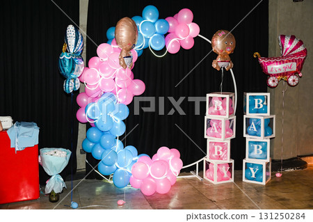 Vladivostok, Russia - 8 September 2025: Creative gender party decorations with pink and blue balloons, baby blocks and festive balloons, no people. 131250284