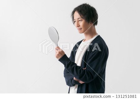 Man smiling in the mirror Man smiling in the mirror 131251081